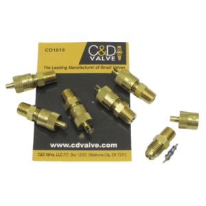Close-up of a C&D CD1818 brass fitting, connecting a 1/4-inch male line to a 1/8-inch female line in an HVAC or refrigeration system.